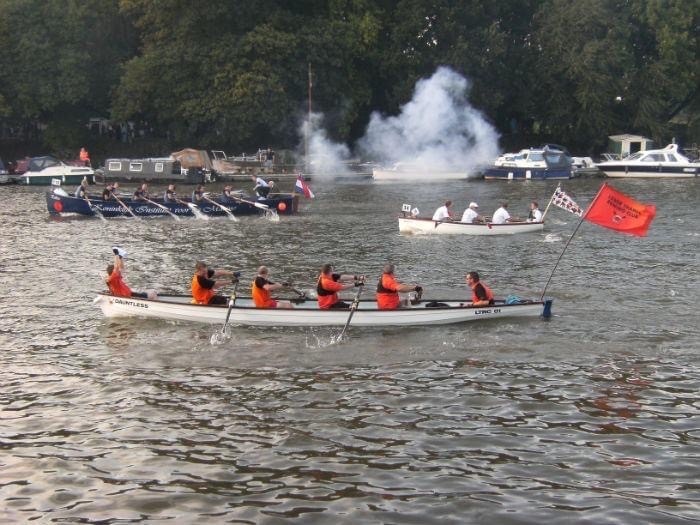 Competitors finishing the Great River Race on the Thames